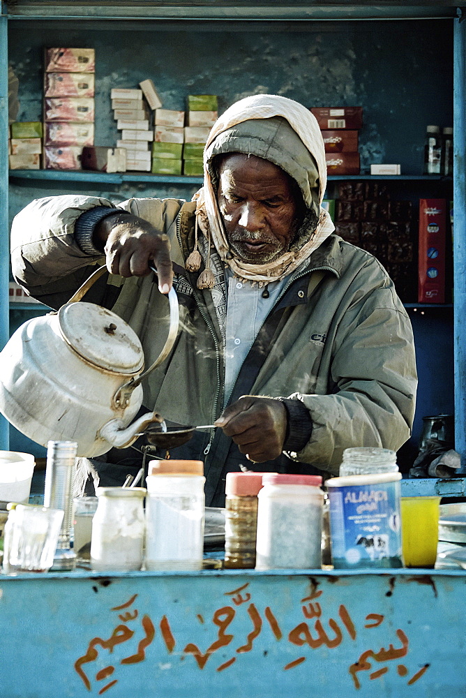 Man preparing tea in his kiosk, Wadi Halfa, Sudan, Africa