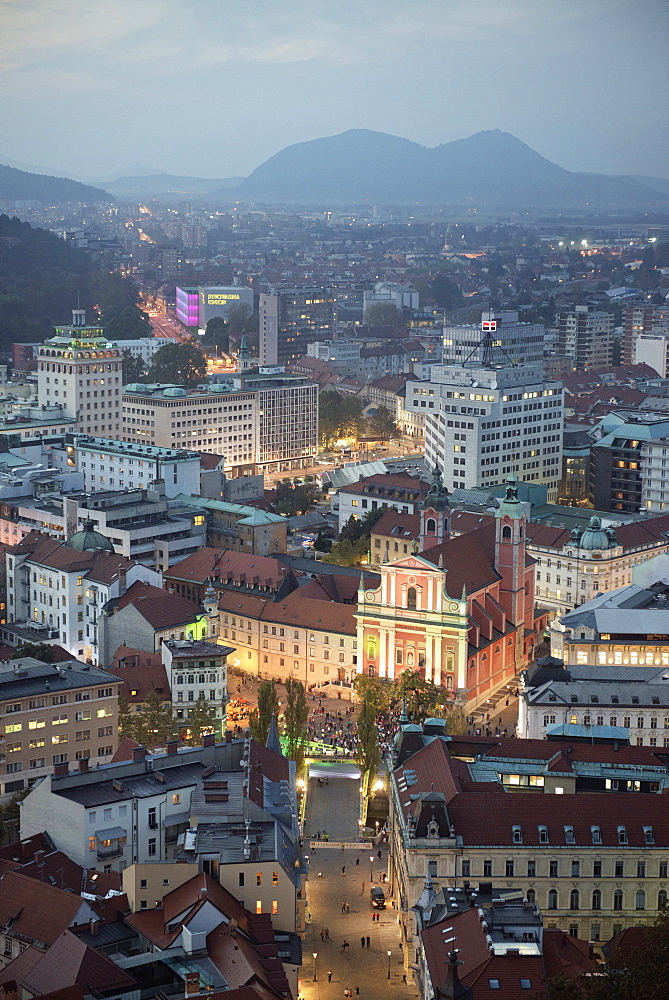 View at Franciscan church of the annunciation from castle at dusk, capital Ljubljana, Slovenia