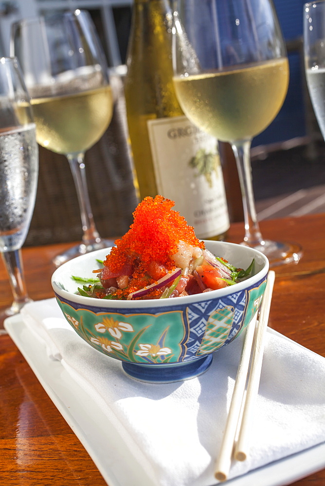 Sashimi Salad made of Bluefin Tuna, Organic Irish Salmon, Wahoo and Hamachi with cucumber, tomatoes and red onion on a bed of turned carrots, lightly dressed with a sesame soy vinaigrette and masago, Restaurant Pierre's, Islamorada, Florida Keys, Florida