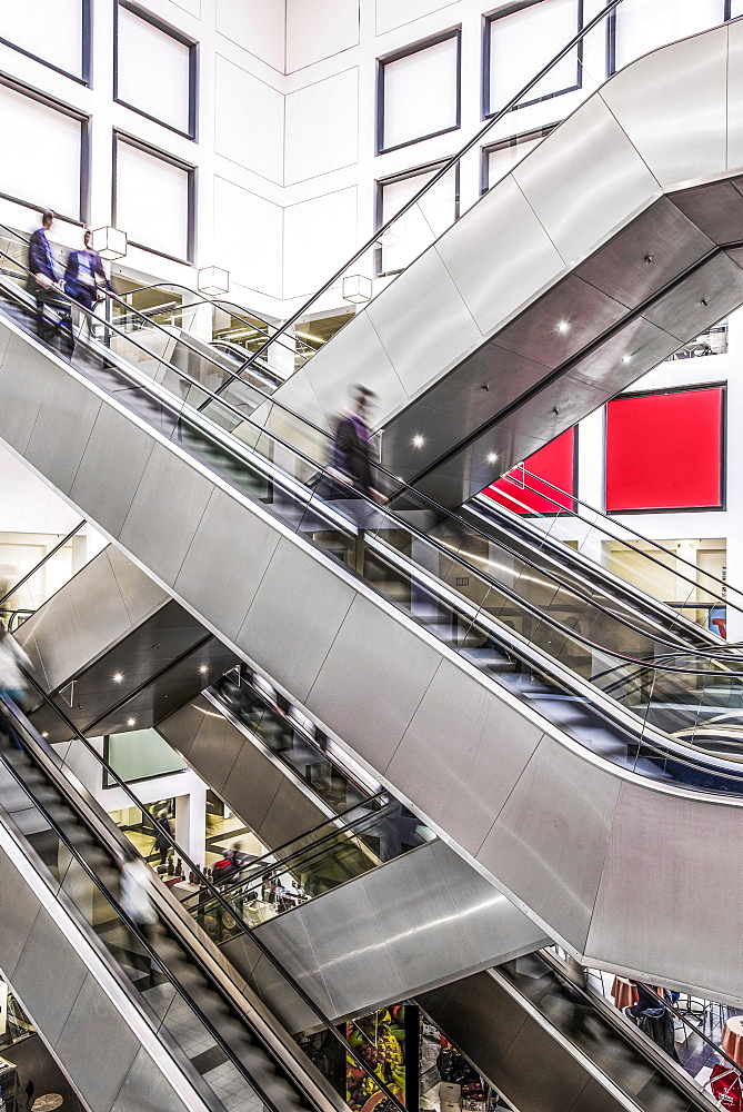 People in motion on escalators in the trade fair centre, Messe Berlin, Charlottenburg-Wilmersdorf, Berlin, Germany