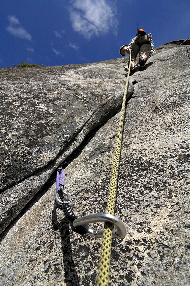 Woman rock climbing in Yosemite National Park, California, USA