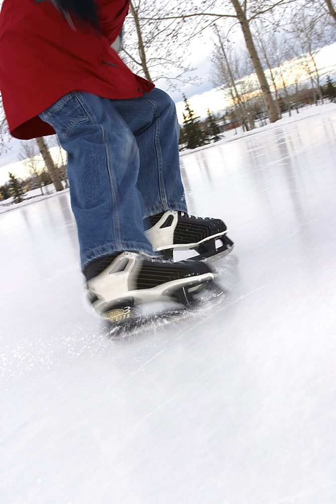 Outdoor Ice Skating, Boy coming to a stop