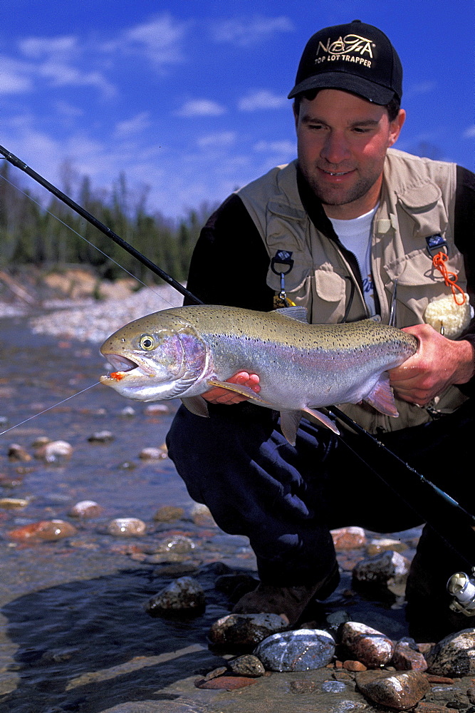 Man with Steelhead Fish along Lake Superior, Northern Ontario