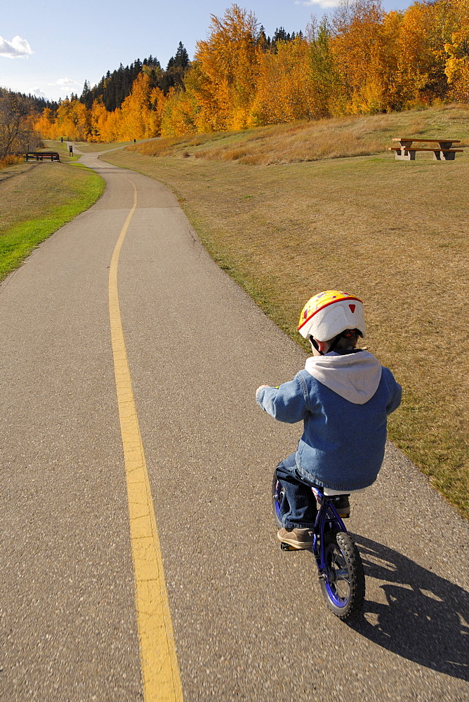 Boy Wearing a Bike Helmet and Biking Recreation Path, Edmonton River Valley, Alberta