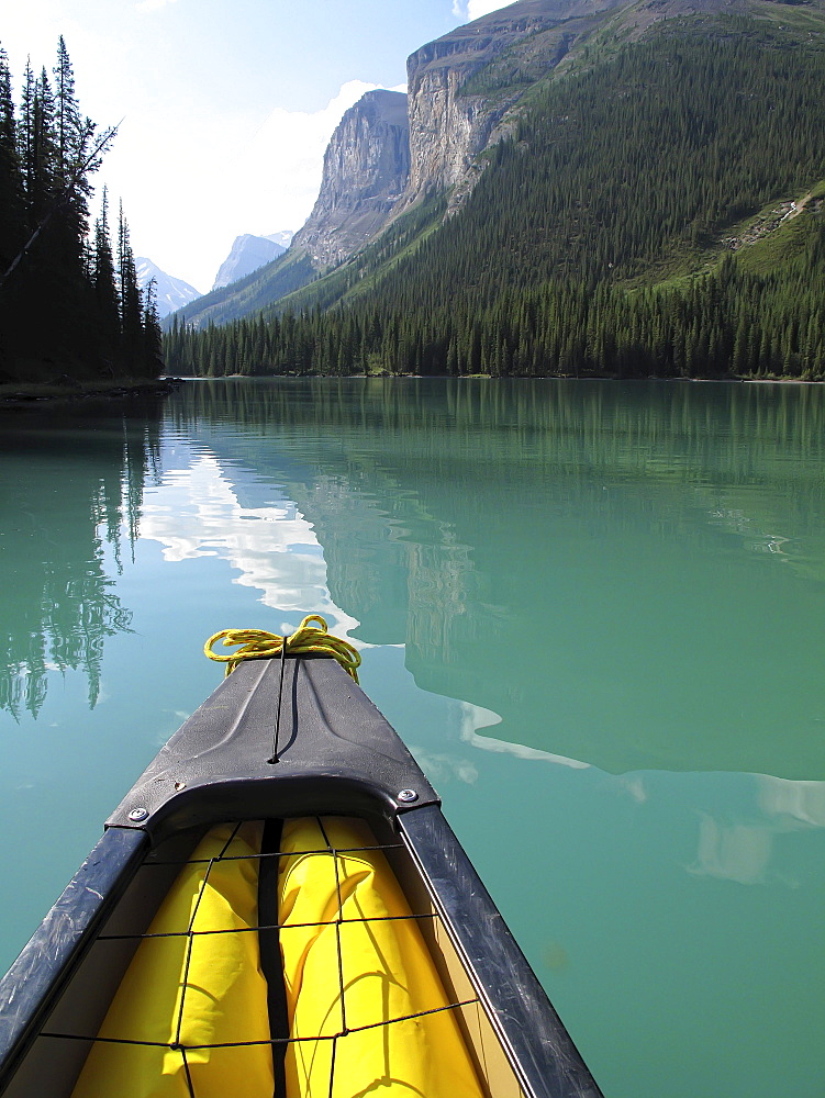 The front of a canoe heading into the Narrows in Maligne Lake, Jasper National Park, Alberta