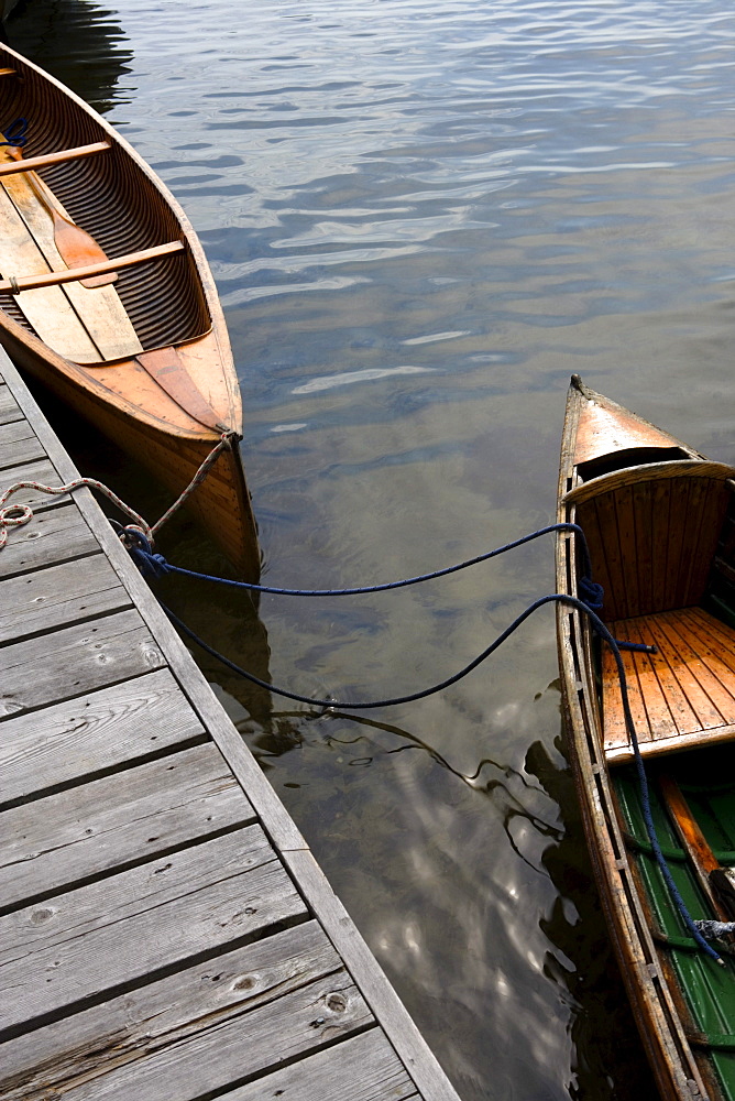 Canoes tired to a dock, Lake Joseph, Muskoka, Ontario