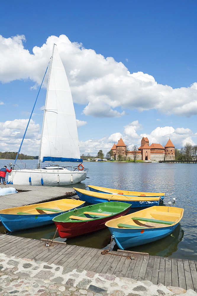 Sail boats on Galve Lake with the Island Castle in the background -Trakai, Lithuania