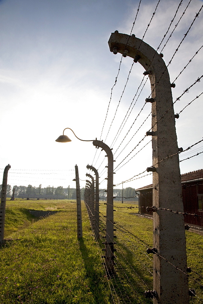 Electrified barbed wire fence separating sections of the Auschwitz-Birkenau Concentration Camp, Oswiecim, Malopolska, Poland