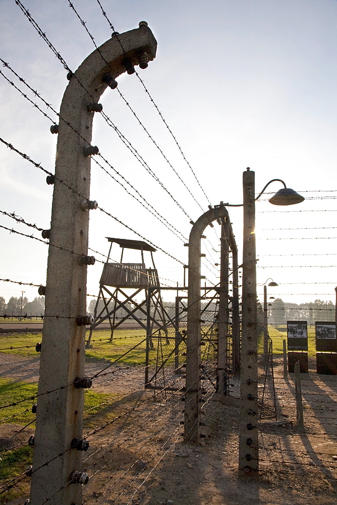 Watchtower, gate to the Hungarian Women's Camp and electrified barbed wire fence, Auschwitz-Birkenau Concentration Camp, Oswiecim, Malopolska, Poland