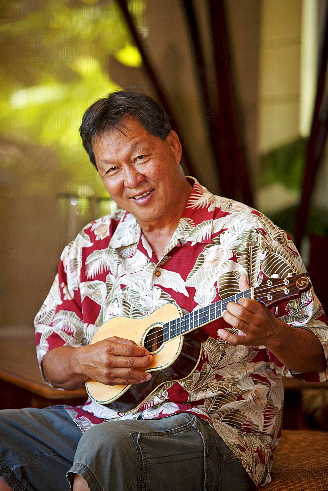 Hawaii, Maui, Local male playing an ukulele.