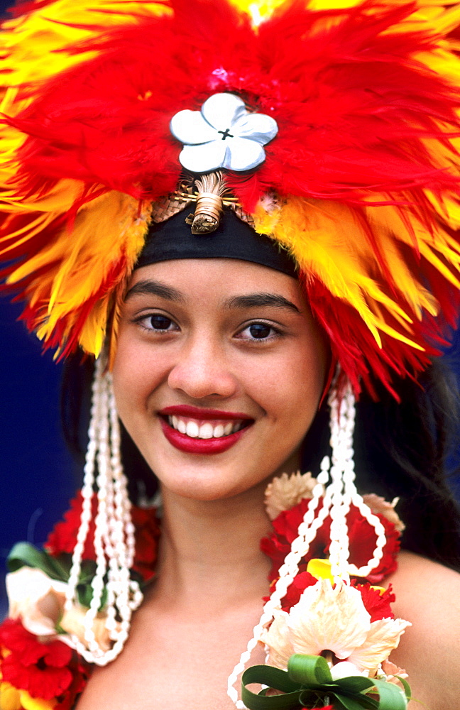 French Polynesia, Tahiti, Bora Bora, Headshot of a beautiful Tahitian dancer in headdress.