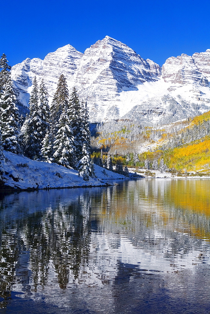 Colorado, Near Aspen, Landscape of Maroon Lake and on Maroon Bells in distance, Early snow.