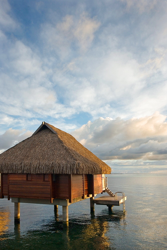 French Polynesia, Moorea Lagoon Resort, Bungalows over beautiful turquoise ocean.