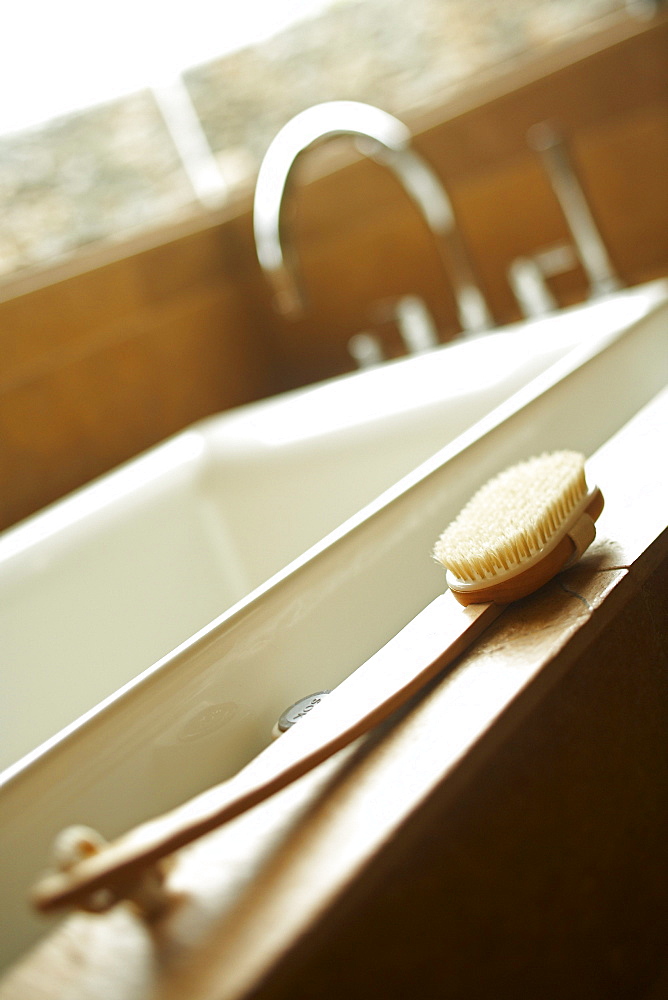 Hawaii, soft peaceful interior bathroom with white tub and scrubber.