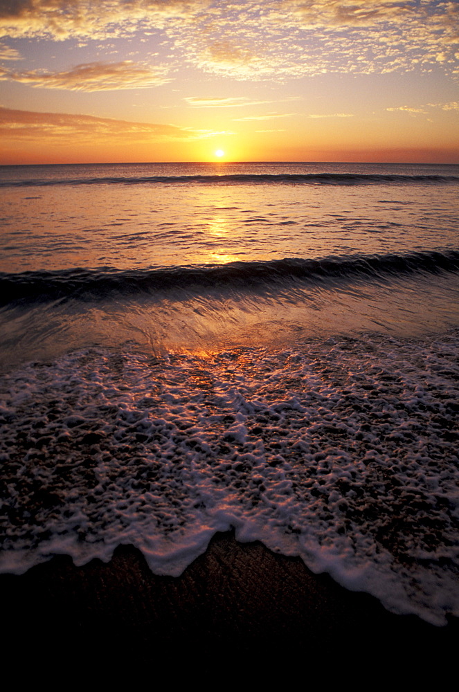 Costa Rica, Guanacaste province, Playa Grande, Sunset over ocean horizon on beach.