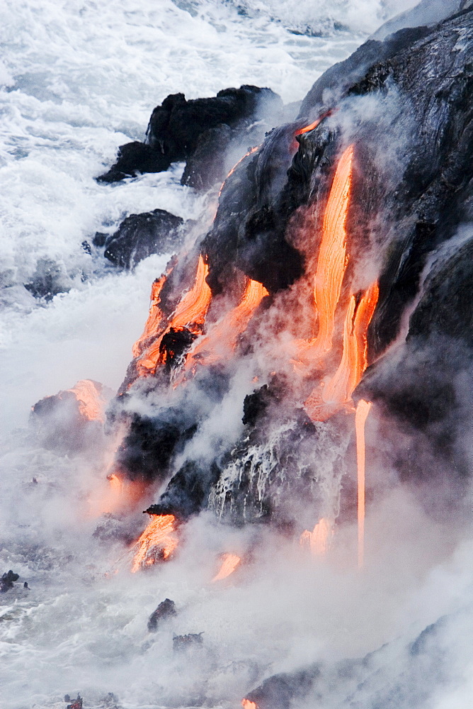 Hawaii, Big Island, near Kalapana, Pahoehoe lava flowing from Kilauea into Pacific Ocean.