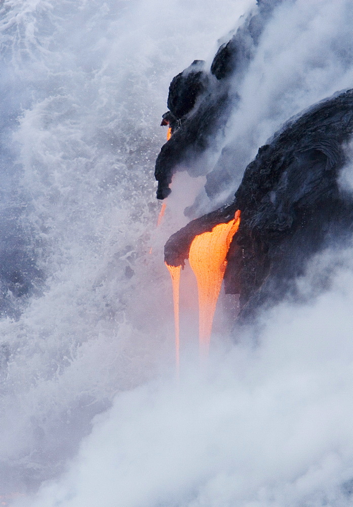 Hawaii, Big Island, near Kalapana, Pahoehoe lava flowing from Kilauea into Pacific Ocean.