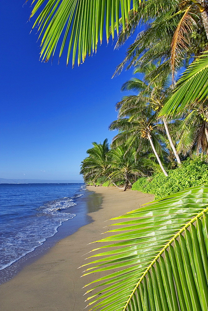 Hawaii, Molokai, A small deserted beach on the south shore, Lanai in the background.