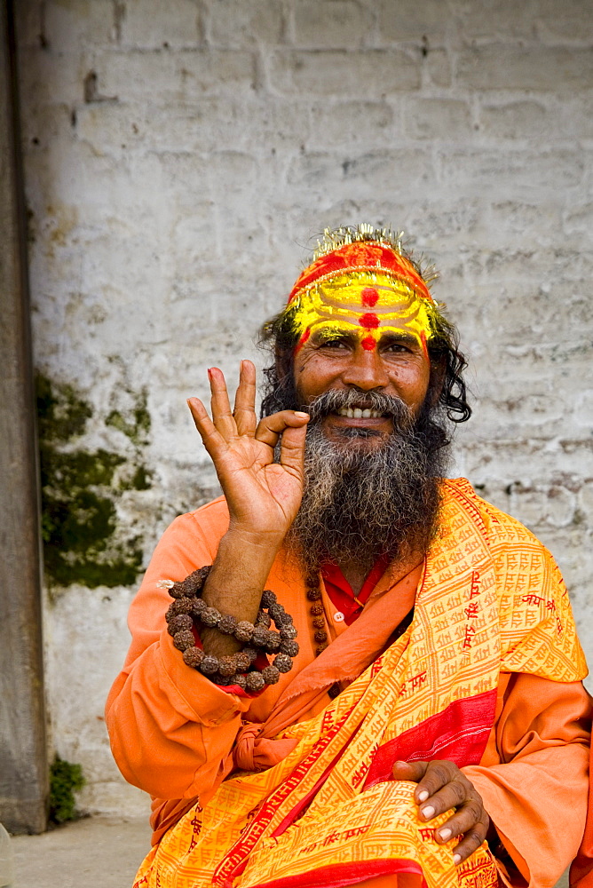 Nepal, Kathmandu,  religious man at Pashupatinath holy Hindu place on Bagmati River, painted and colorfully dressed.