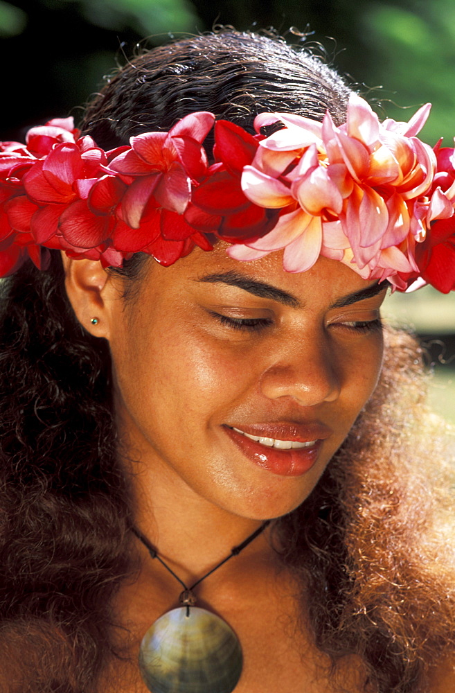 Fiji, Beautiful young local woman, wearing flower haku, close-up of face.