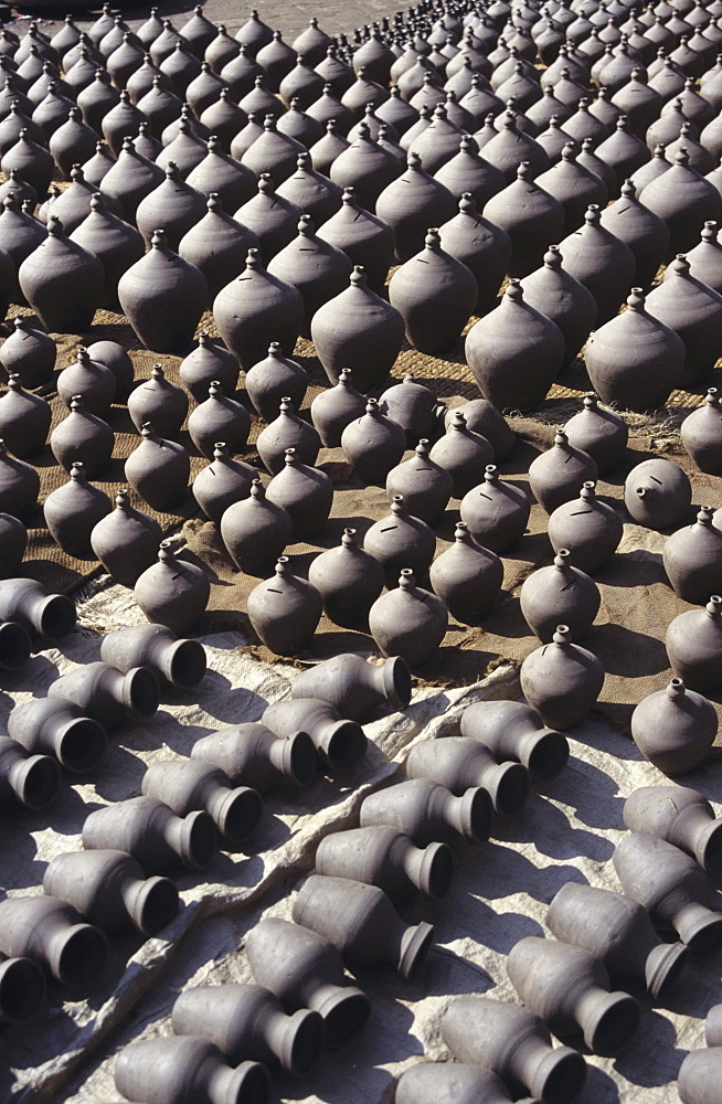 Nepal, Bhaktapur, Potter's Square, vases of various sizes lined up in rows, view from above.