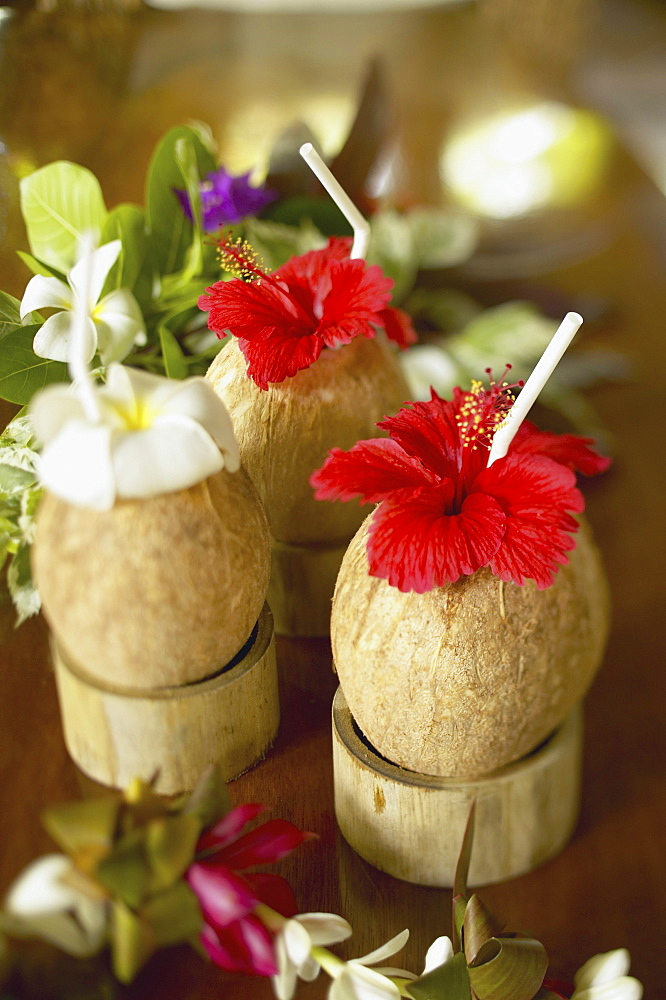 French Polynesia, Bora Bora, Close-up of a refreshing tropical cocktails in coconut cups