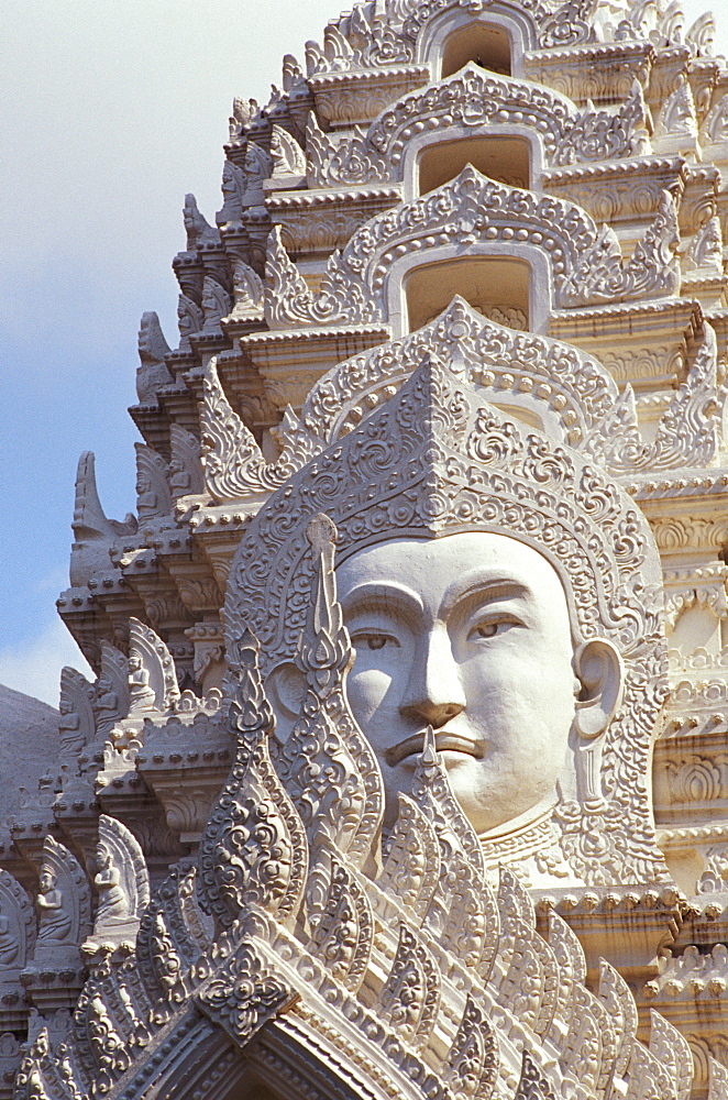 Thailand, Bangkok, Wat Ratchapradt, Buddha Image on ornate stone temple.