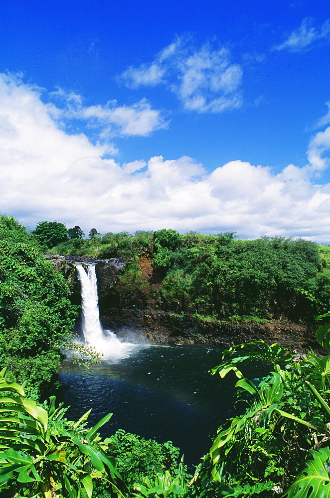 Hawaii, Big Island, Hilo, Wailuku River State Park, Rainbow Falls, Rainbow in mist of waterfall.