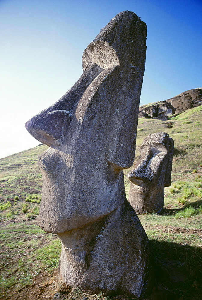 Easter Island, Close-up of Moai stone statue, cloudless blue sky