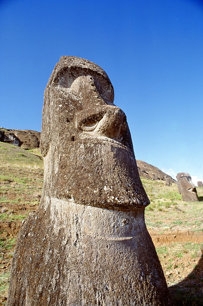 Easter Island, Close-up of Moai stone statue, cloudless blue sky