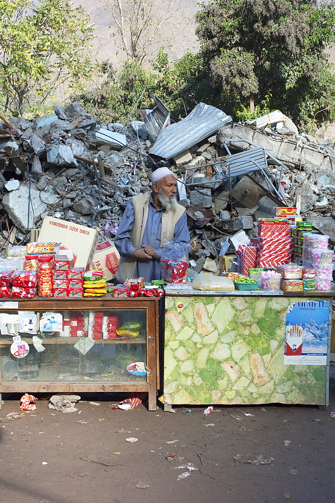 Man At His Shop In Front Of The Bazaar Destroyed By The 8 October 2005 Earthquake, Chinari, Azad Kashmir, Pakistan