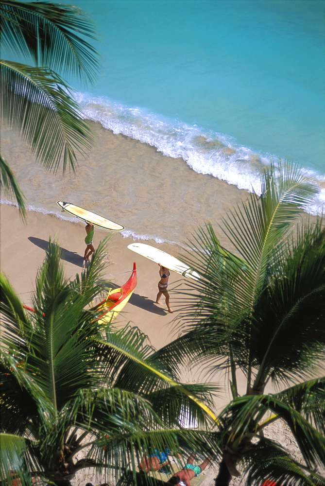 Hawaii, Oahu, Shoreline At Waikiki Beach, Surfers Carry Surfboards Atop Head D1511