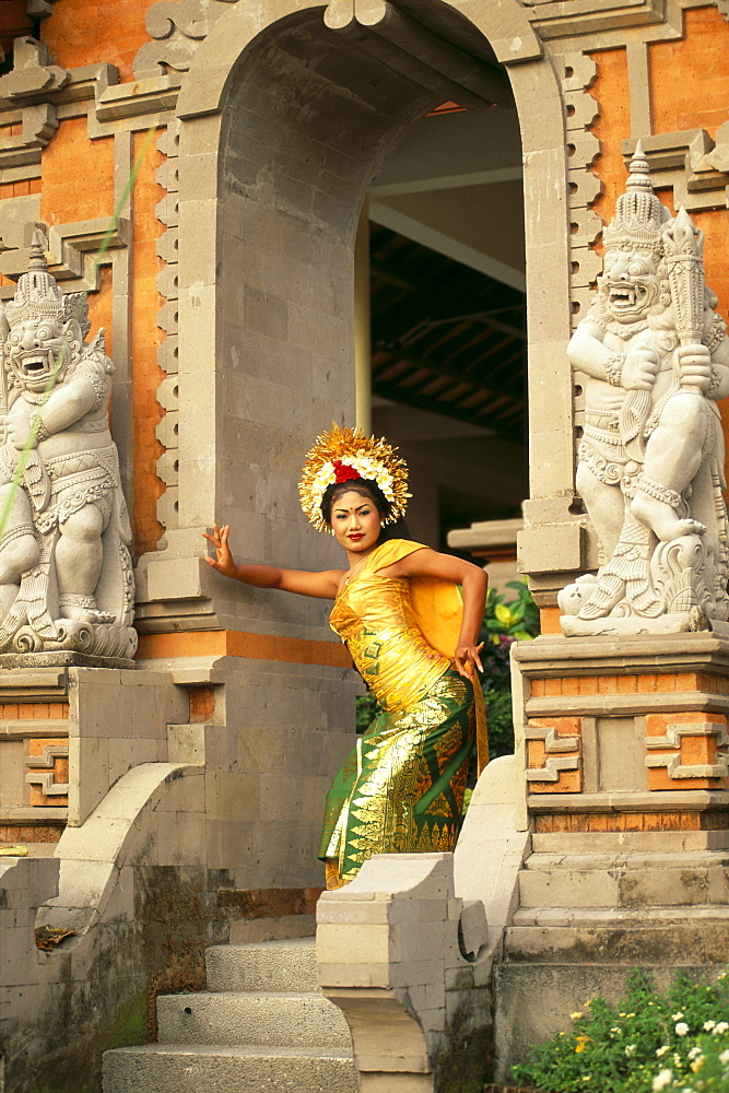 Indonesia, Bali, Legong Dancer Poses In Entranceway B1760