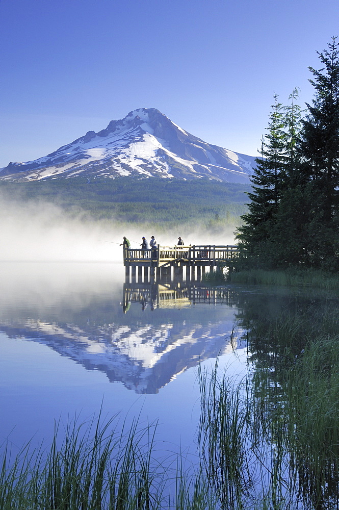 Fishermen Casting From A Dock On A Foggy Morning, Trillium Lake, Oregon