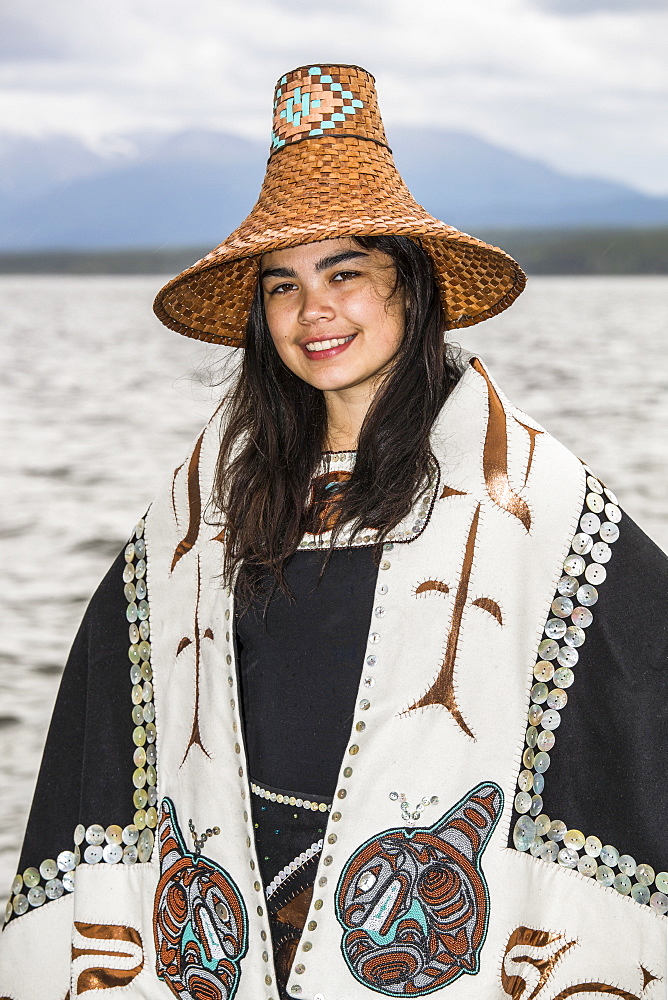 Tlingit first nation woman in traditional wardrobe on the shores of Teslin Lake, Teslin, Yukon, Canada