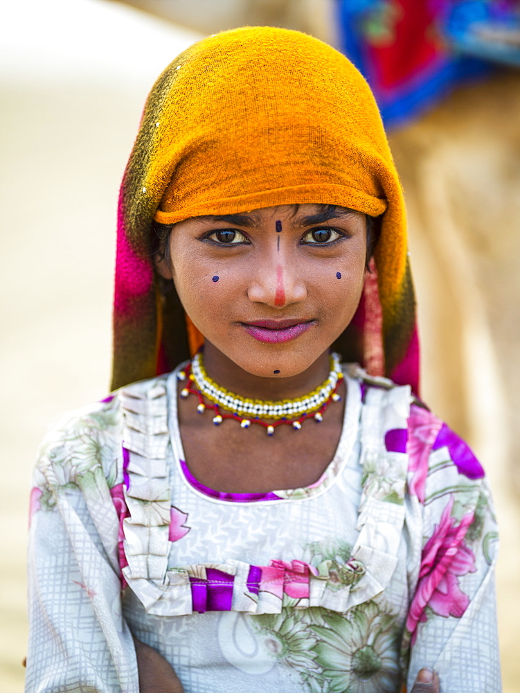 Portrait of a young Indian girl with markings on her face, Kanoi, Rajasthan, India