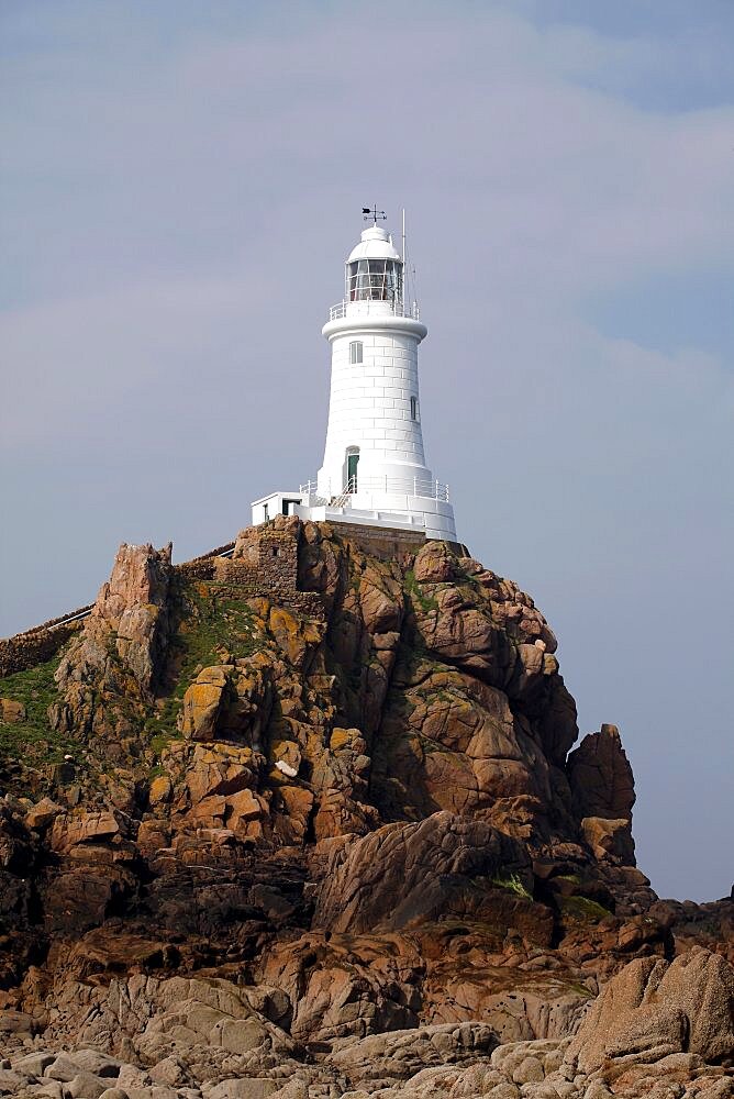 Rocks and white La Corbiere Lighthouse, Jersey, Channel Islands, United Kingdom, Europe