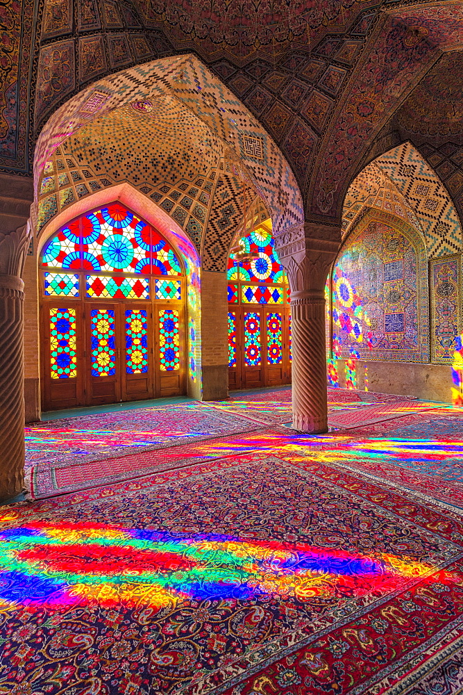 Nasir-ol-Molk Mosque (Pink Mosque), light patterns from colored stained glass illuminating the iwan, Shiraz, Fars Province, Iran, Middle East