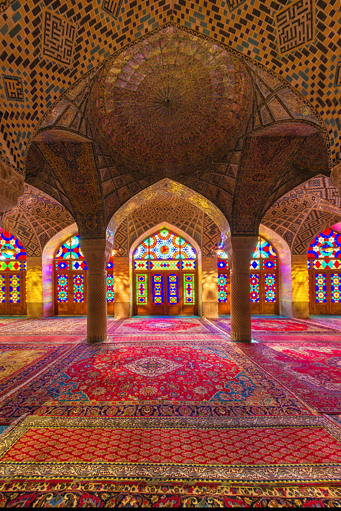 Nasir-ol-Molk Mosque (Pink Mosque), light patterns from colored stained glass illuminating the iwan, Shiraz, Fars Province, Iran, Middle East