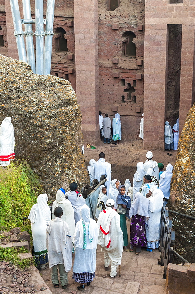 Pilgrims with the traditional white shawl attending a ceremony at the Bete Medhane Alem Church, Lalibela, Amhara region, Northern Ethiopia, Africa 