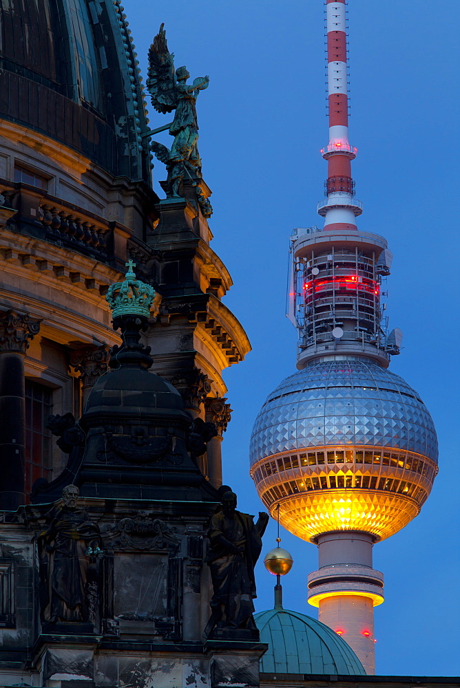 Close-up of the Berliner Dom (Cathedral) with the Television Tower in the background at night, Berlin, Germany, Europe 