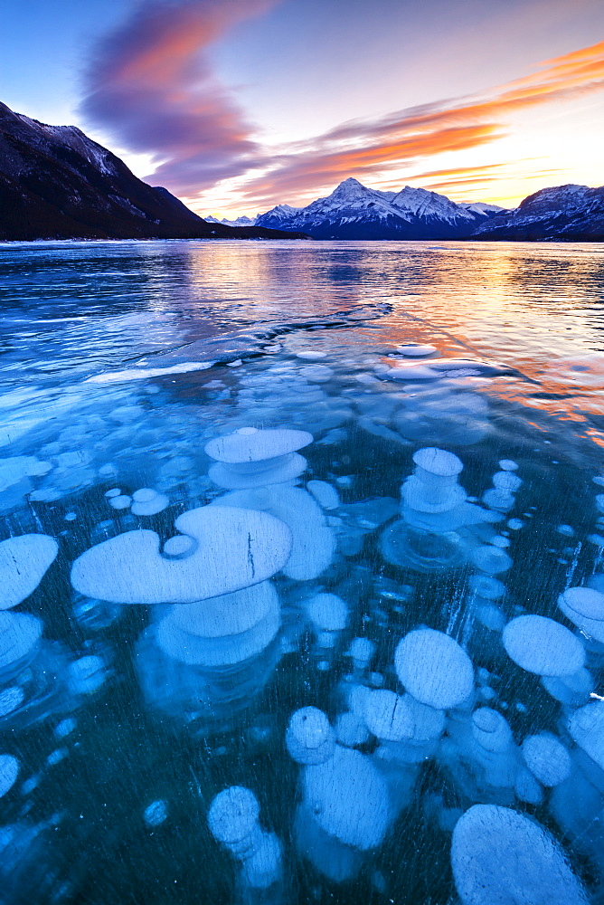 Bubbles and Cracks in the Ice with Elliot Peak in the Background, Abraham Lake, Alberta, Canada, North America