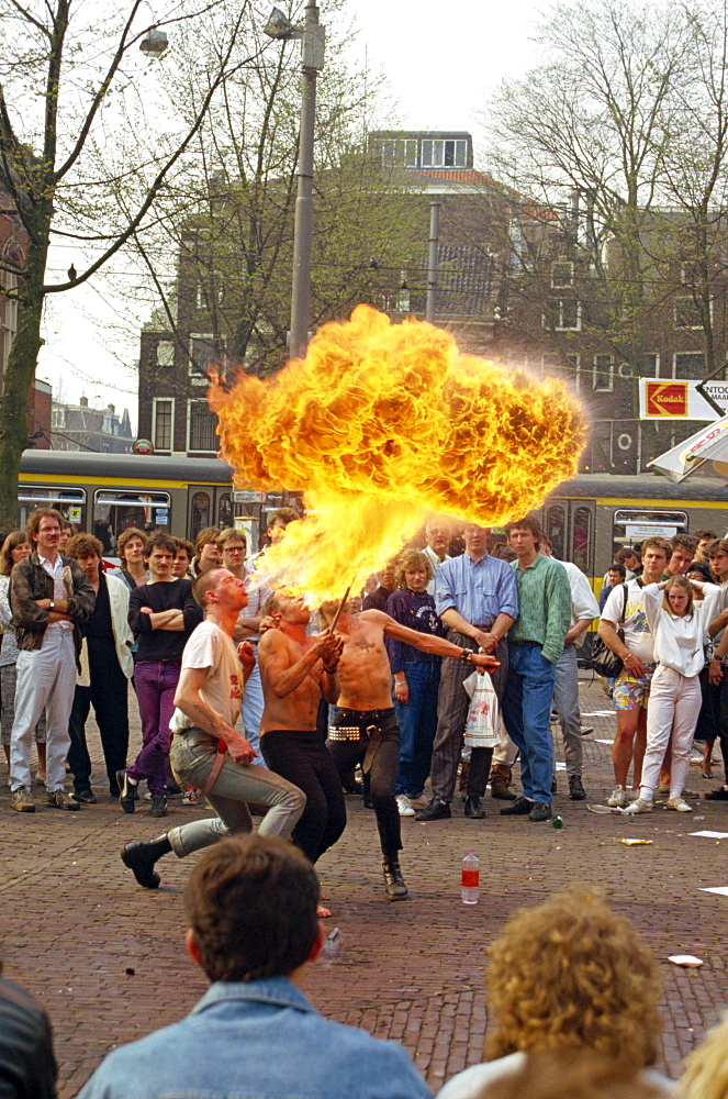 Fire breathers performing on Leidseplein, Amsterdam, Holland, Europe