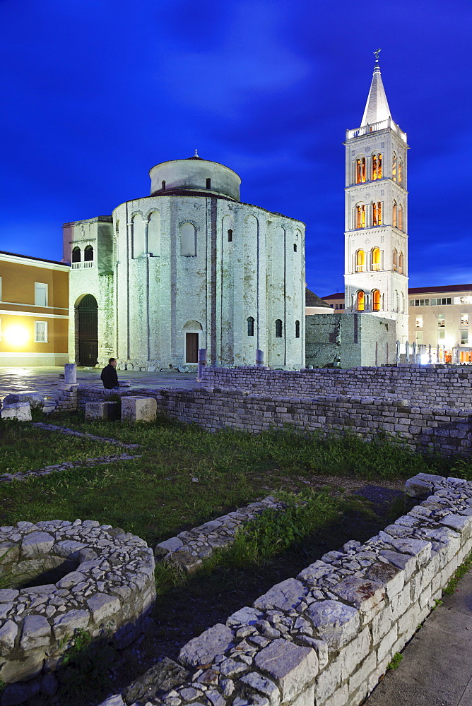 Illuminated Roman forum (Forum Romanum), St. Donat's church and the bell tower of St. Anastasia cathedral at dusk, Zadar, Dalmatia, Croatia, Europe