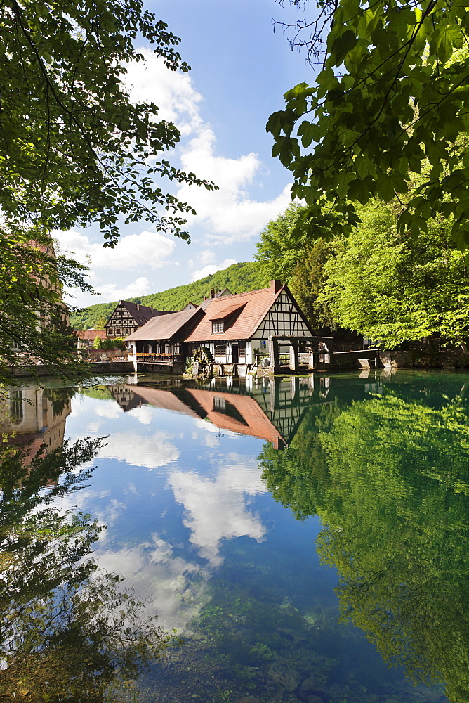 Mill reflecting in Blautopf Spring, Blaubeuren, Swabian Alb, Baden Wurttemberg, Germany, Europe