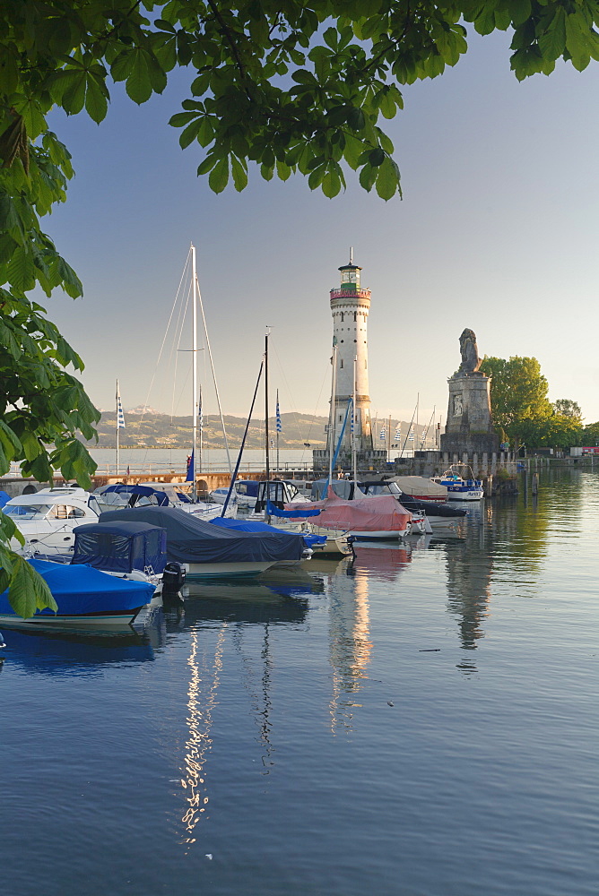 Lighthouse and Bavarian Lion at the port at sunset, Lindau, Lake Constance, Bavaria, Germany, Europe