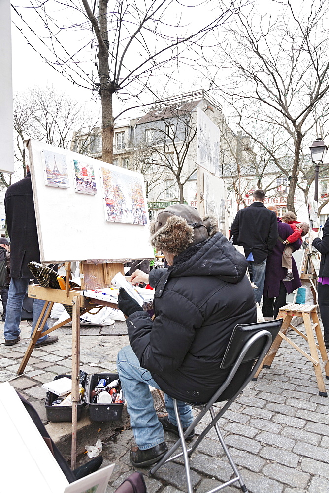 Painter at the art market at Place du Tertre, Montmartre, Paris, Ile de France, France, Europe