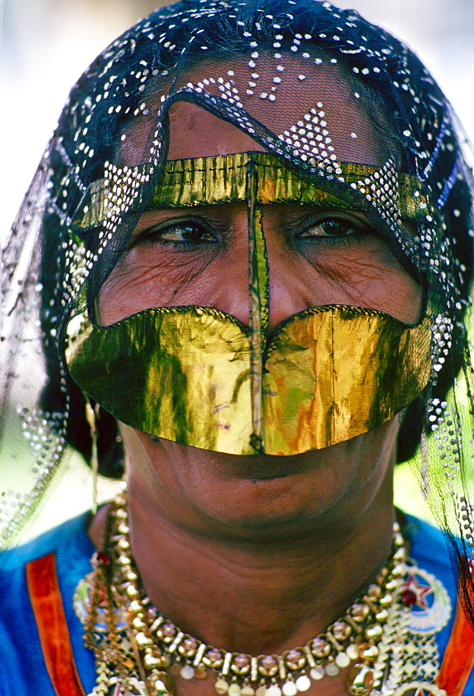 A Bedouin woman wearing traditional headgear and asaba headcovering , Abu Dhabi