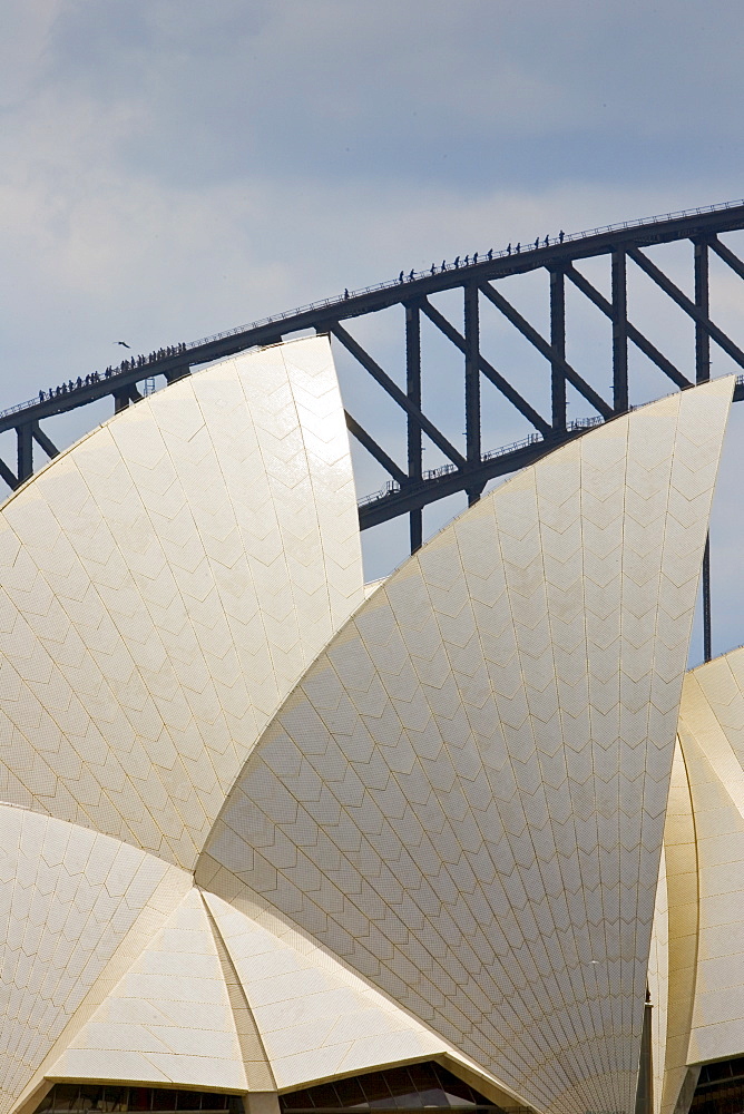 Sydney Opera House and tourists walking over  the Sydney Harbour Bridge walkway, Australia