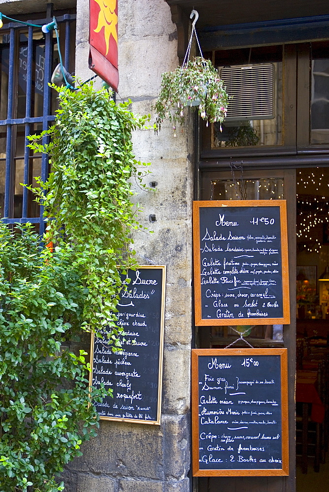 French menus outside cafe restaurant in Bordeaux, France.